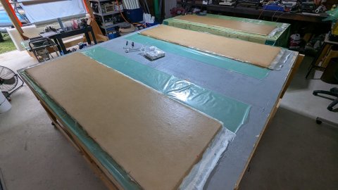 Over 100 4x8 sheets of honeycomb core becoming composite panels.